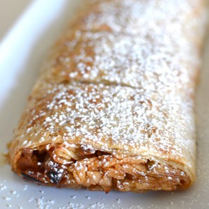 a beautiful apple strudel topped with powdered sugar